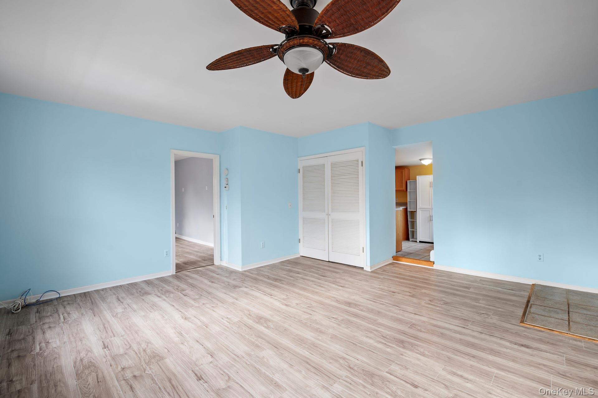 82 Shingle House Road Millwood, NY 10546 - Photo 30 of 50 a view of an empty room with wooden floor and a ceiling fan