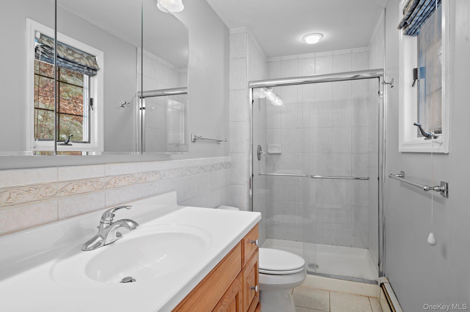 82 Shingle House Road Millwood, NY 10546 - Photo 32 of 50 a bathroom with a sink toilet and shower