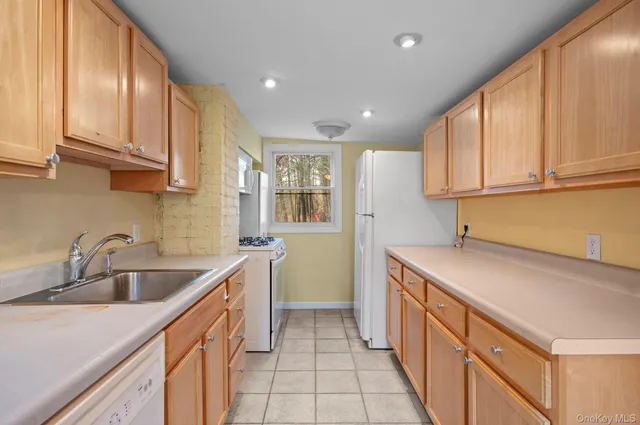a kitchen with a sink and a window