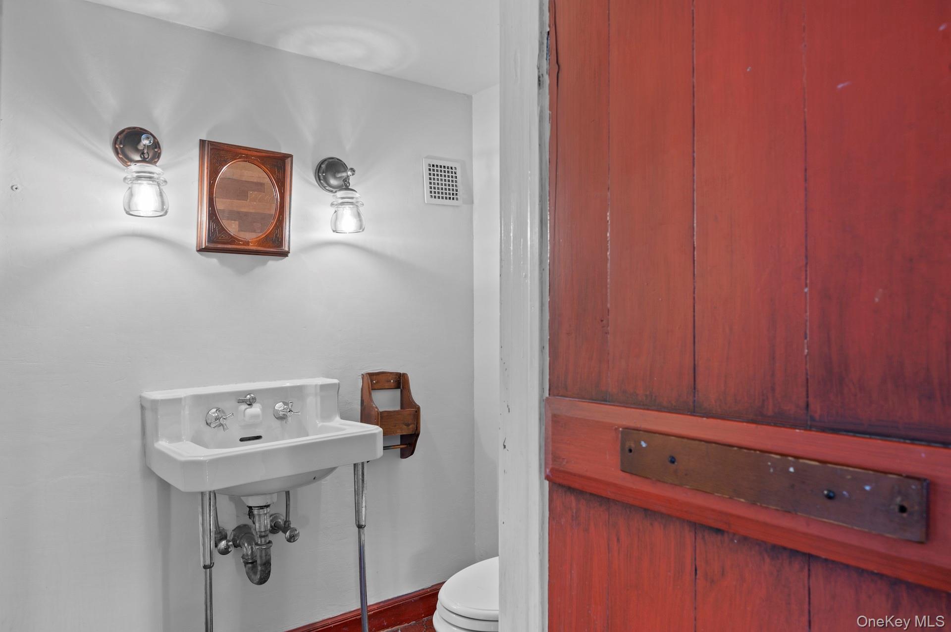 82 Shingle House Road Millwood, NY 10546 - Photo 5 of 50 a bathroom with a sink a toilet and mirror
