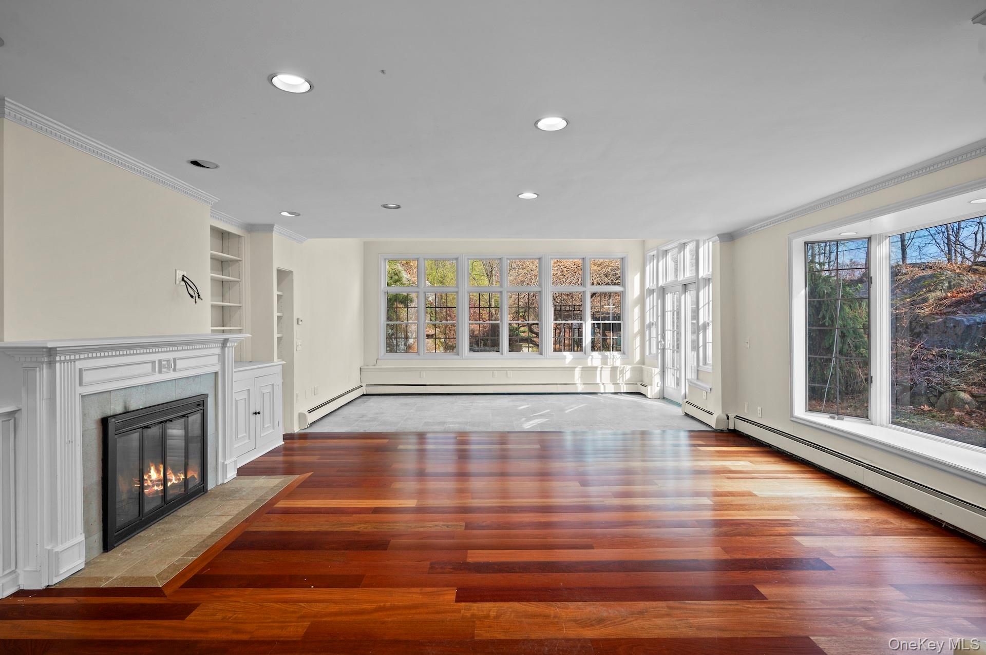82 Shingle House Road Millwood, NY 10546 - Photo 7 of 50 a view of an empty room with wooden floor and a window