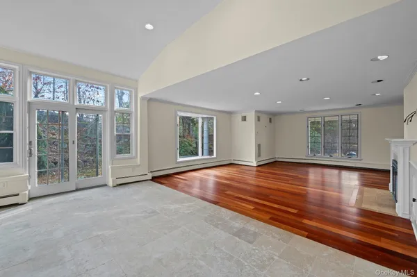 a view of an empty room with glass door