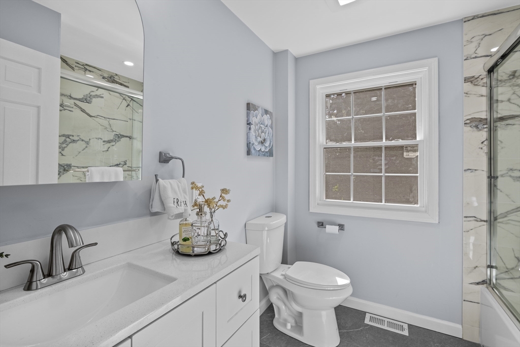 108 Radcliffe Road Belmont, MA 02478 - Photo 17 of 31 a bathroom with a toilet sink and mirror