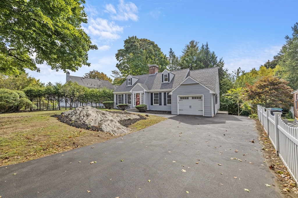 108 Radcliffe Road Belmont, MA 02478 - Photo 2 of 31 a view of a house with large trees and wooden fence