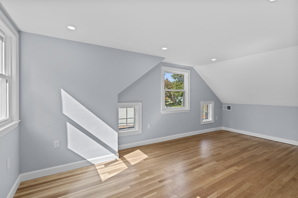 108 Radcliffe Road Belmont, MA 02478 - Photo 25 of 31 a view of an empty room with wooden floor and a window