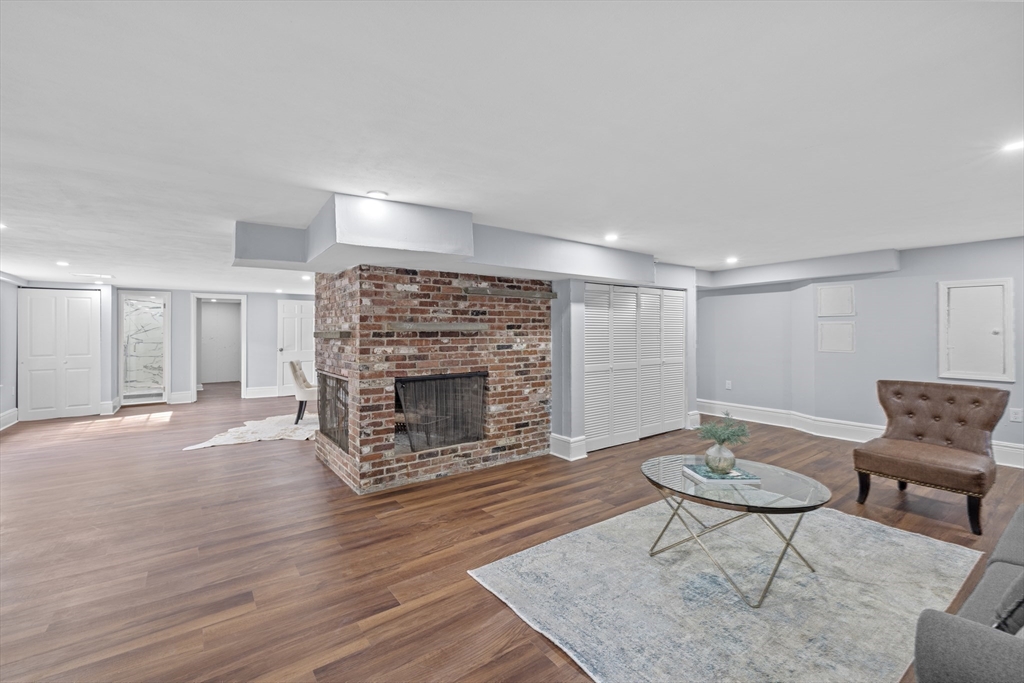 108 Radcliffe Road Belmont, MA 02478 - Photo 29 of 31 a living room with furniture and a fireplace