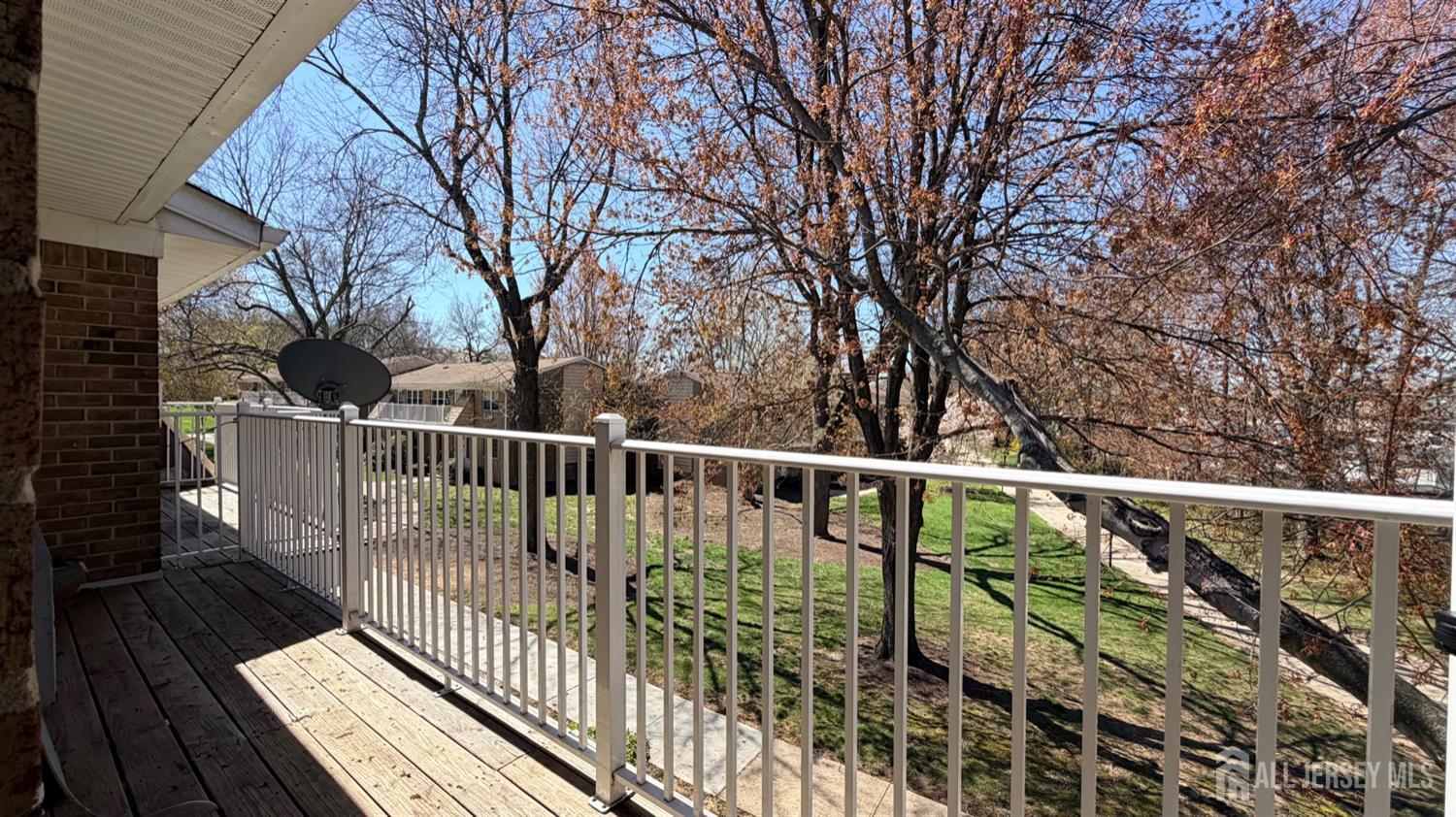 363 Cranbury Road, Unit D16 East Brunswick, NJ 08816 - Photo 22 of 32 a view of balcony with wooden floor and fence