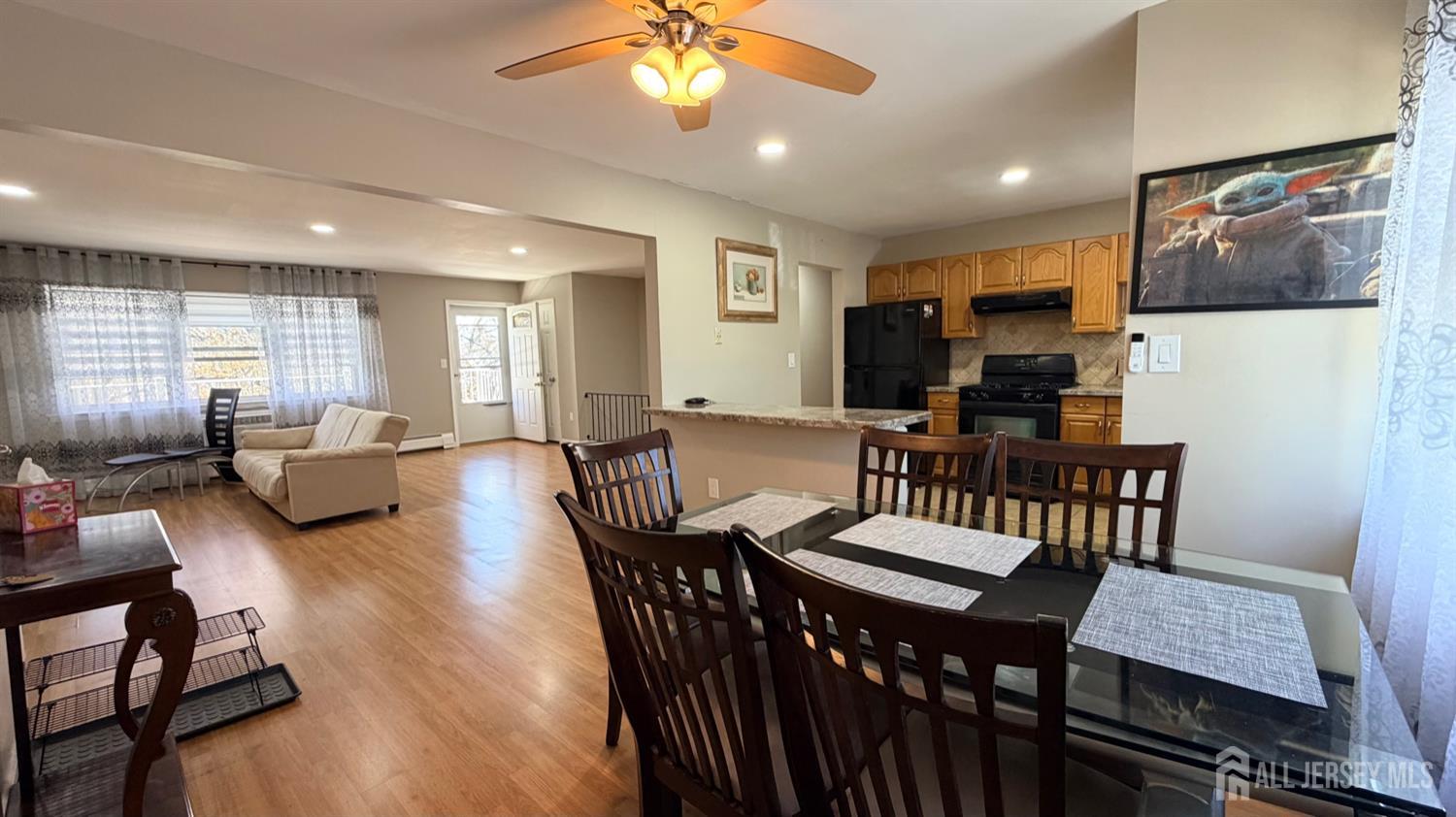 363 Cranbury Road, Unit D16 East Brunswick, NJ 08816 - Photo 24 of 32 a view of a a dining room with furniture window and wooden floor