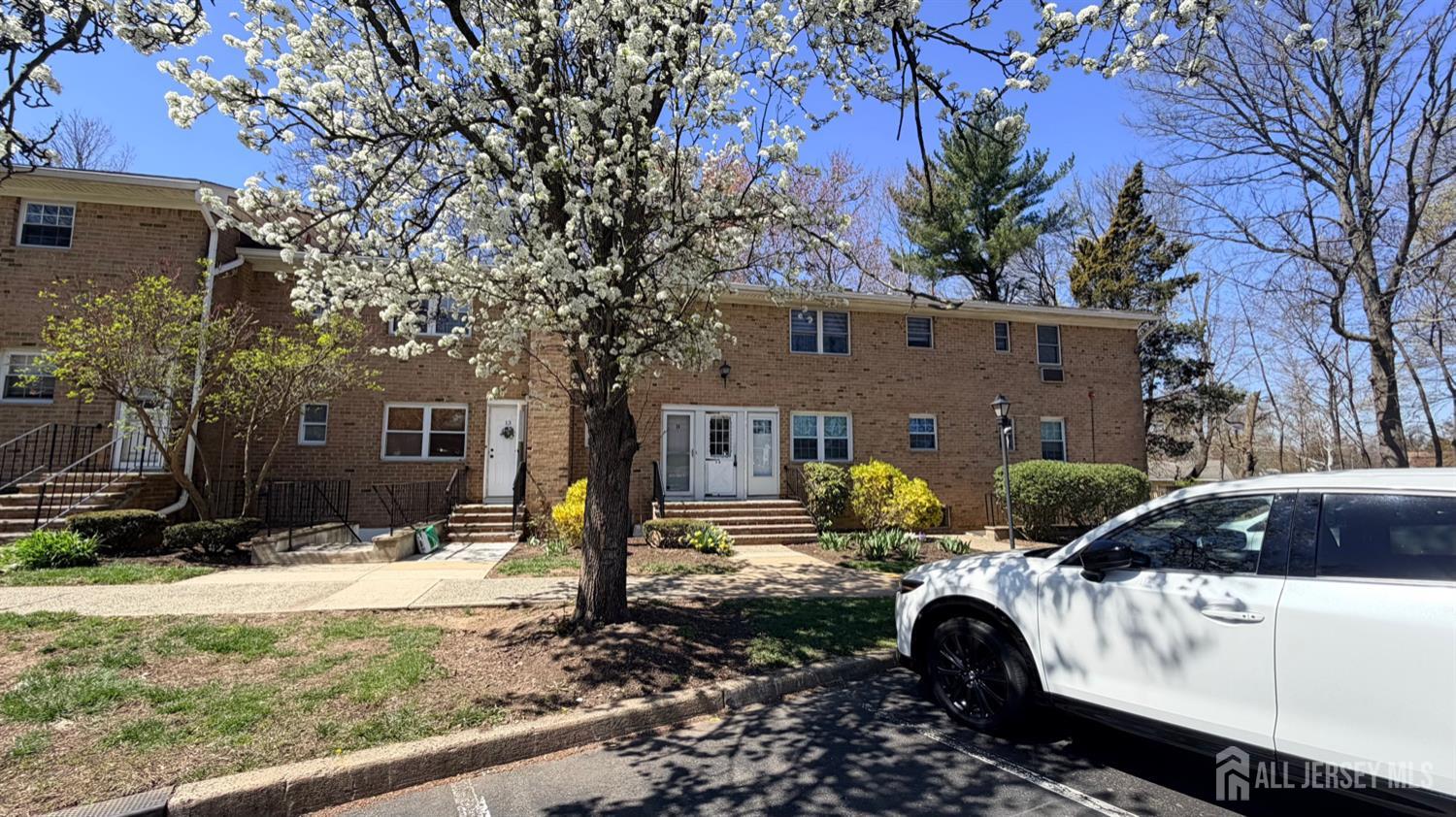 363 Cranbury Road, Unit D16 East Brunswick, NJ 08816 - Photo 30 of 32 a backyard of a house with yard fire pit and outdoor seating