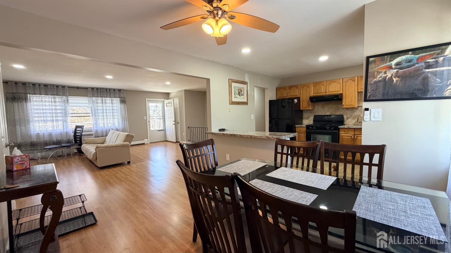 363 Cranbury Road, Unit D16 East Brunswick, NJ 08816 - Photo 3 of 32 a view of a dining room with furniture and wooden floor