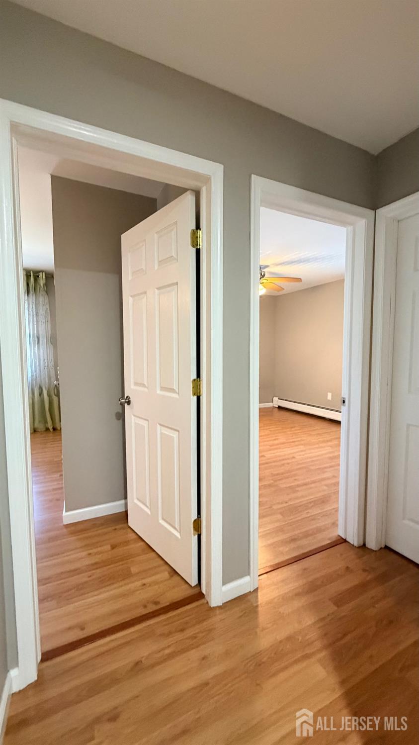 363 Cranbury Road, Unit D16 East Brunswick, NJ 08816 - Photo 10 of 32 a view of a hallway with wooden floor and closet
