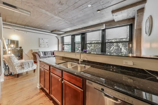 a bedroom with a bed and a couch