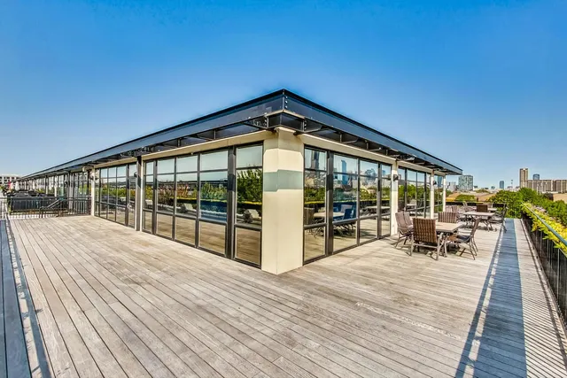 a view of balcony with wooden floor and seating space