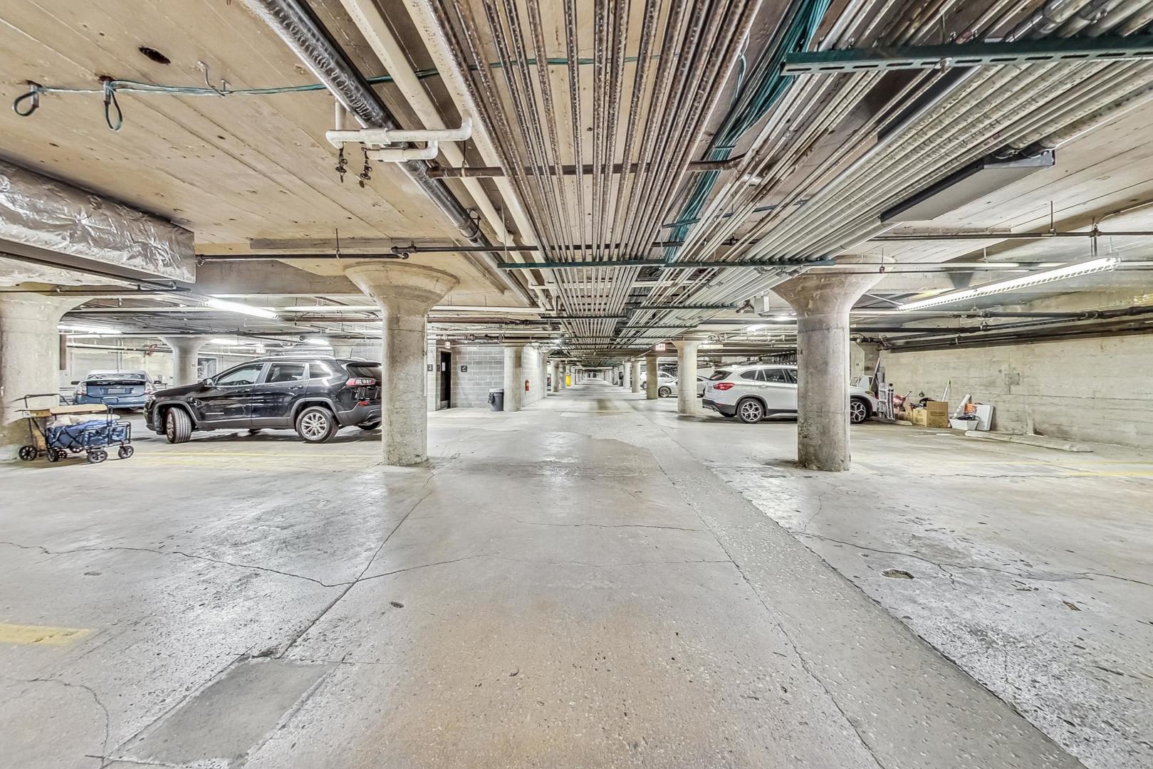1001 West 15th Street, Unit 241 Chicago, IL 60608 - Photo 40 of 41 a view of parking garage with cars