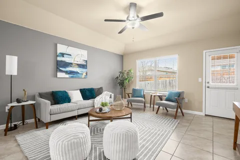 a living room with furniture and a large window