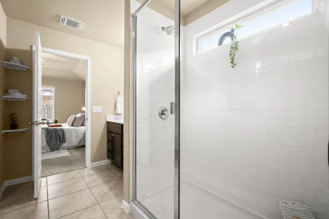 a bathroom with a bathtub and a shower