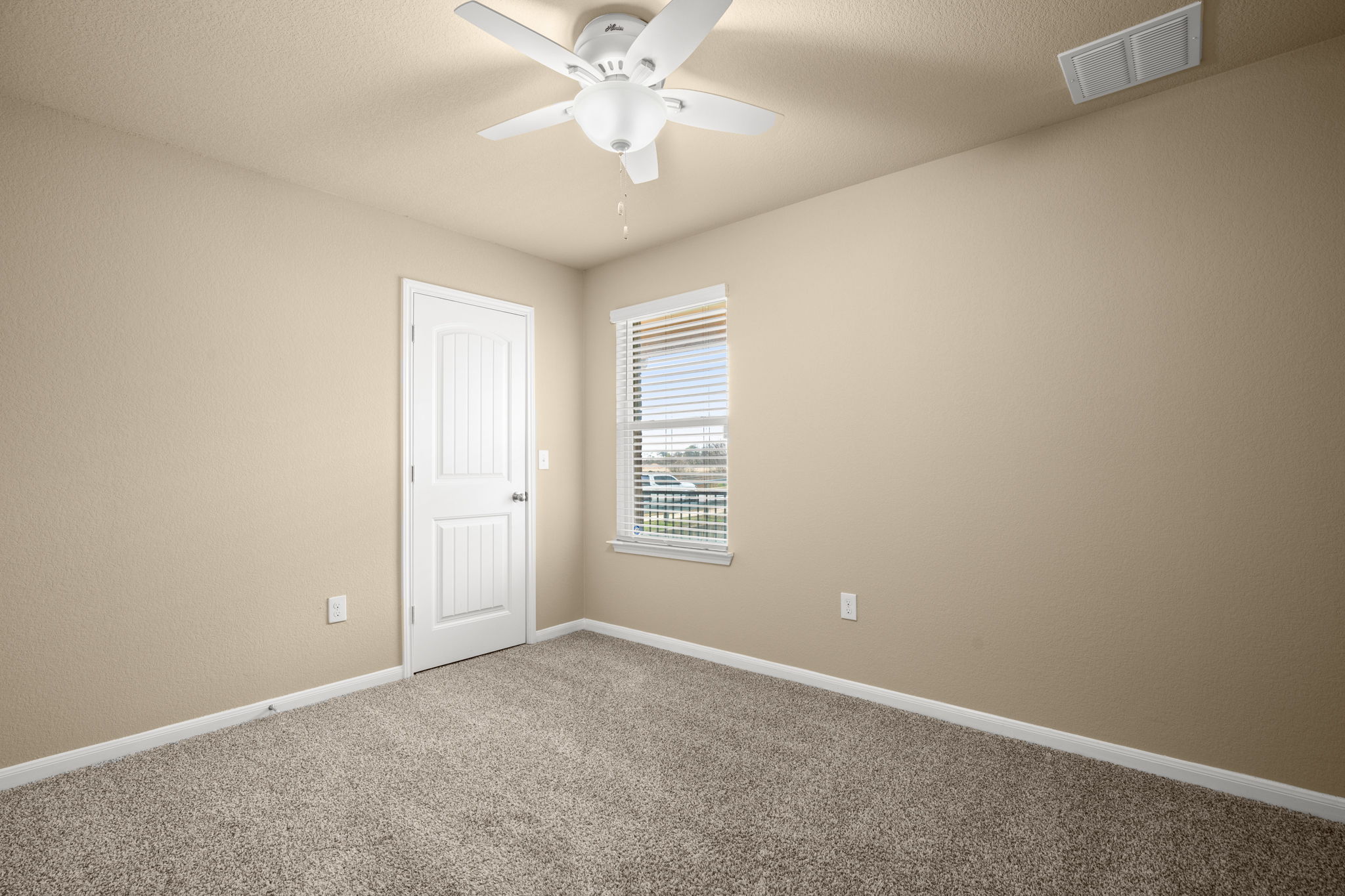 3100 Crystal Bend Drive Pflugerville, TX 78660 - Photo 19 of 32 Carpeted empty room featuring baseboards and a ceiling fan
