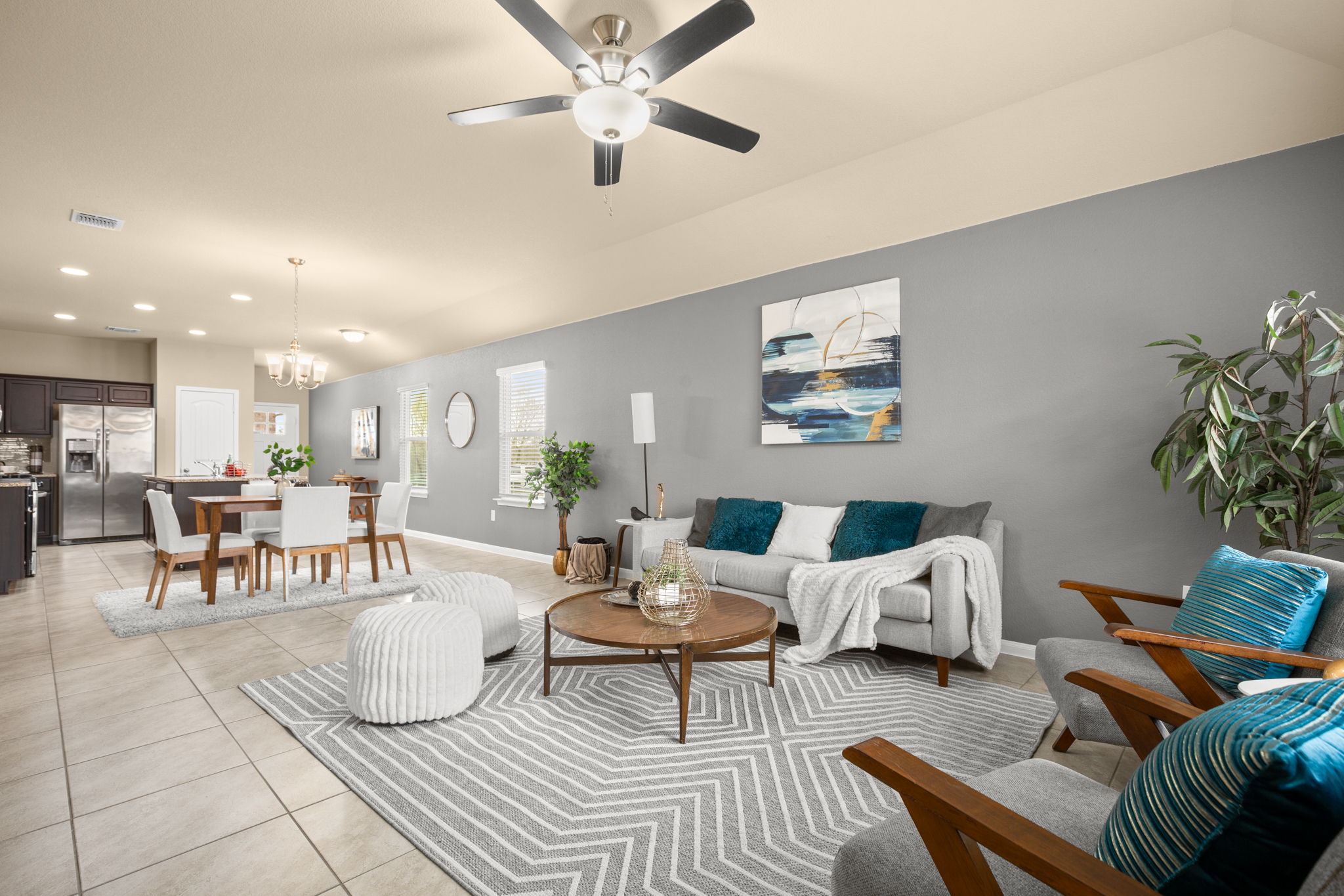 3100 Crystal Bend Drive Pflugerville, TX 78660 - Photo 4 of 32 Living room with recessed lighting, light tile patterned floors, a chandelier, and ceiling fan