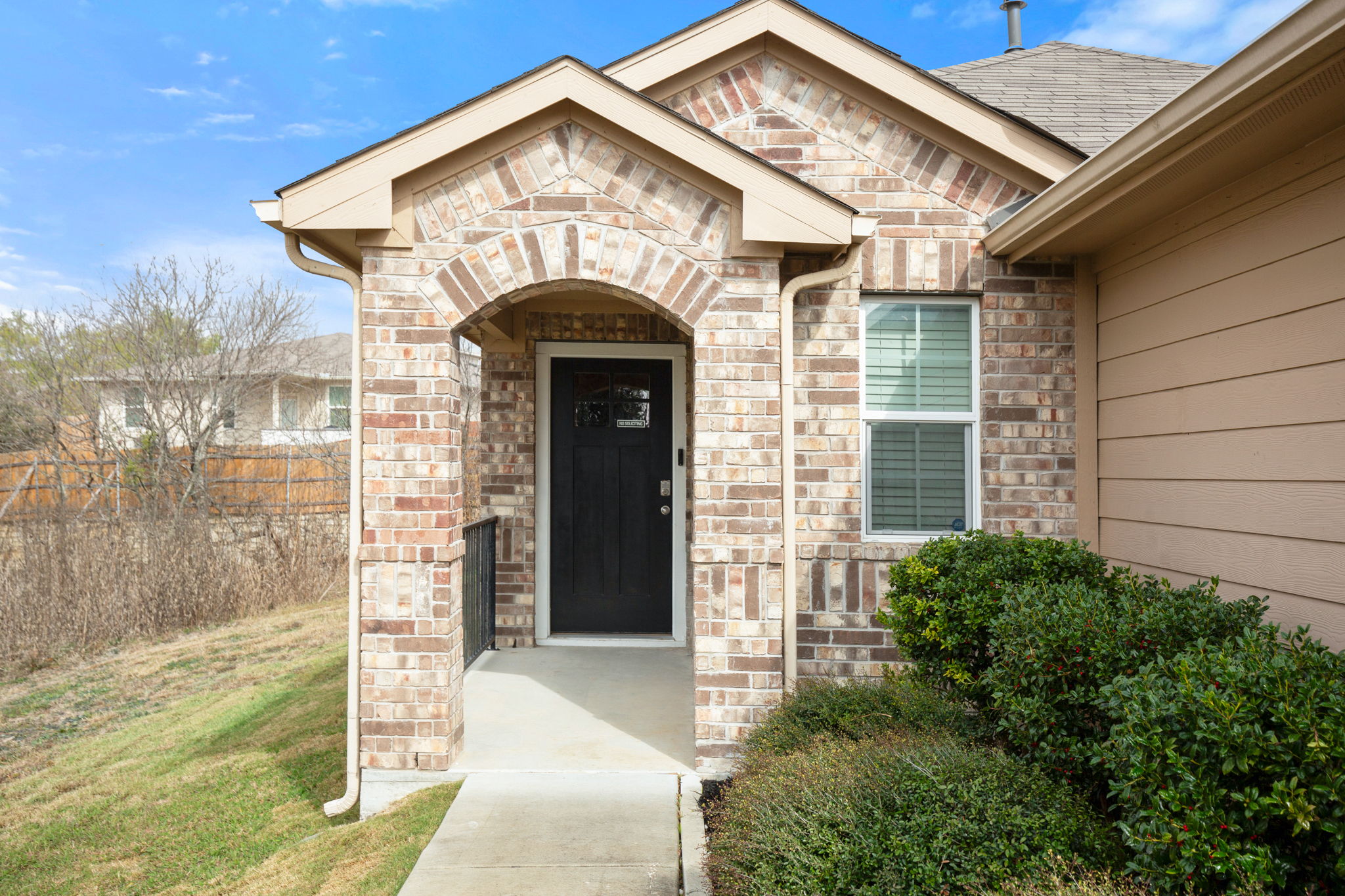 3100 Crystal Bend Drive Pflugerville, TX 78660 - Photo 10 of 32 Property entrance with brick siding and roof with shingles