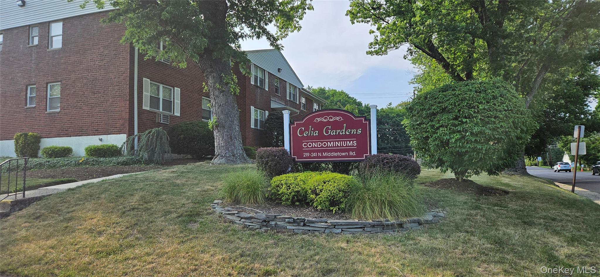 237 North Middletown Road, Unit H Pearl River, NY 10965 - Photo 1 of 14 Community / neighborhood sign featuring a lawn