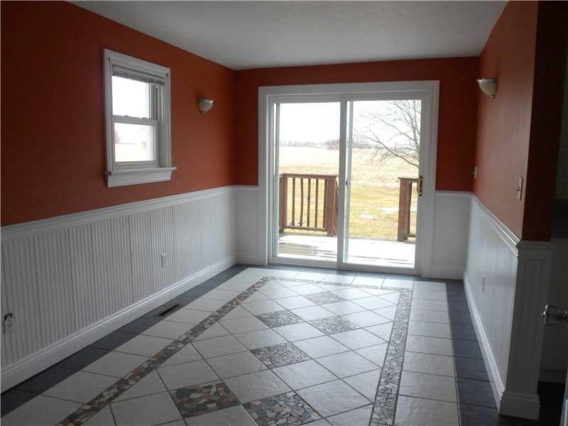 7 Kinsman Road Greenville, PA 16125 - Photo 6 of 19 Dining Room. Dining area off kitchen has patio doors to back deck and yard.Detailed ceramic tile floor and wainscoting.