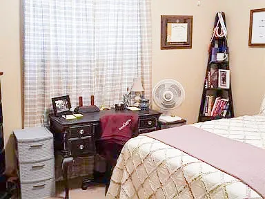 a bedroom with a bed and a closet