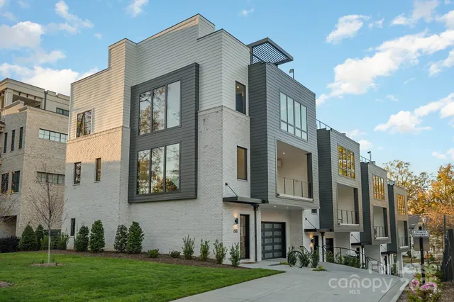 a view of a brick building next to a yard