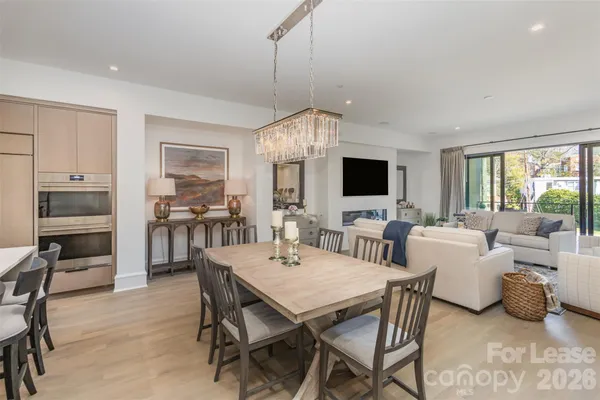 a view of a dining room with furniture window and wooden floor