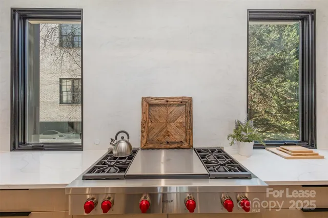 a table with window and white walls