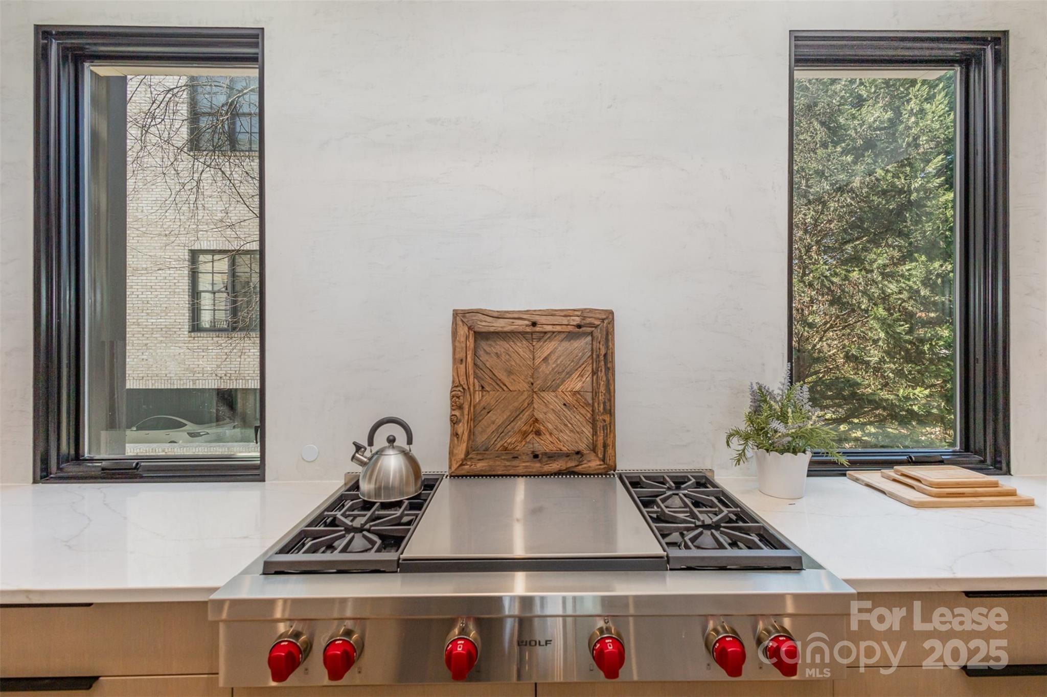616 Queens Road Charlotte, NC 28204 - Photo 19 of 36 a table with window and white walls