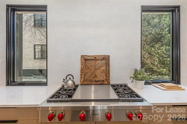 a table with window and white walls