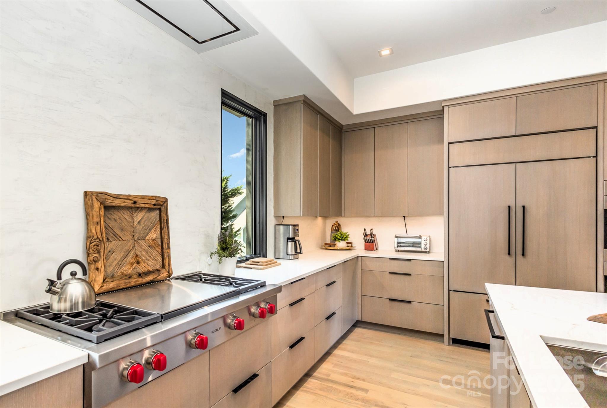 616 Queens Road Charlotte, NC 28204 - Photo 20 of 36 a kitchen with stainless steel appliances a sink stove and refrigerator
