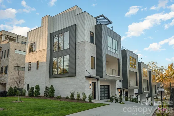 a view of a building next to a yard