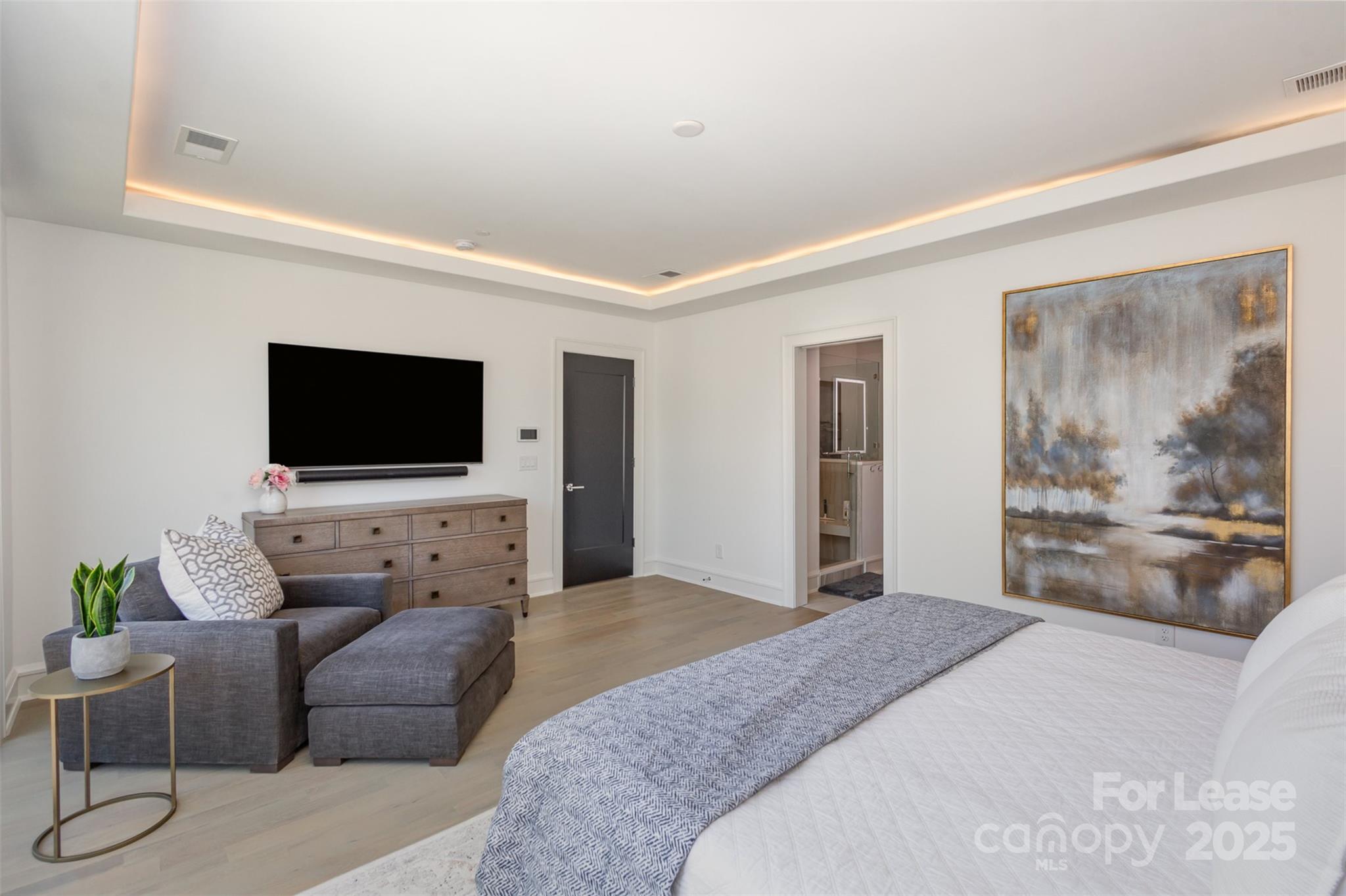 616 Queens Road Charlotte, NC 28204 - Photo 25 of 36 a bedroom with furniture and a flat screen tv