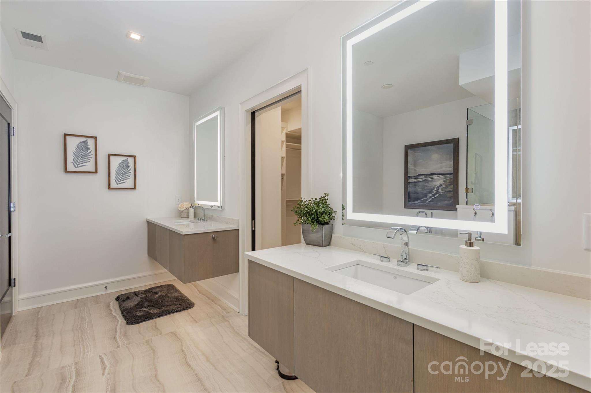 616 Queens Road Charlotte, NC 28204 - Photo 27 of 36 a bathroom with a sink and a mirror