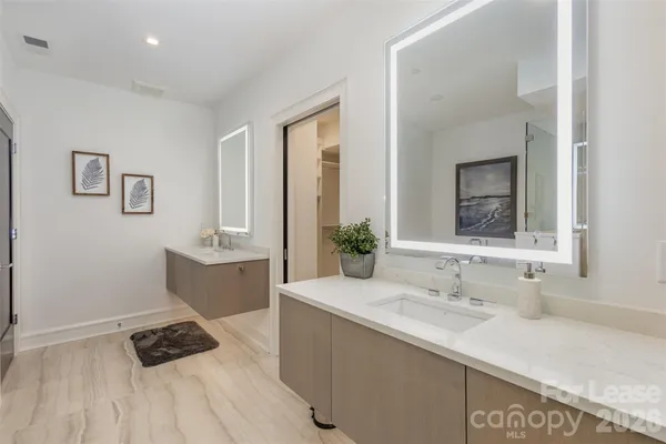 a white bath tub sitting in a bathroom