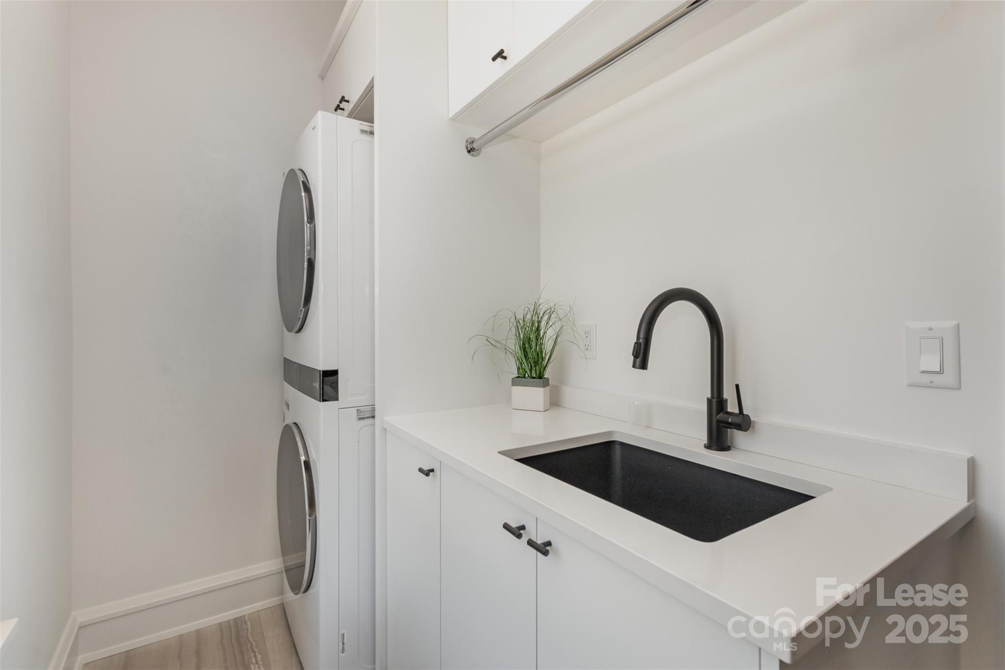 616 Queens Road Charlotte, NC 28204 - Photo 29 of 36 a close view of a sink a faucet and stainless steel appliances