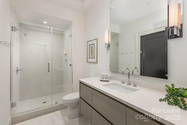 a bedroom with bed and window