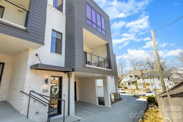 a view of a brick building with many windows