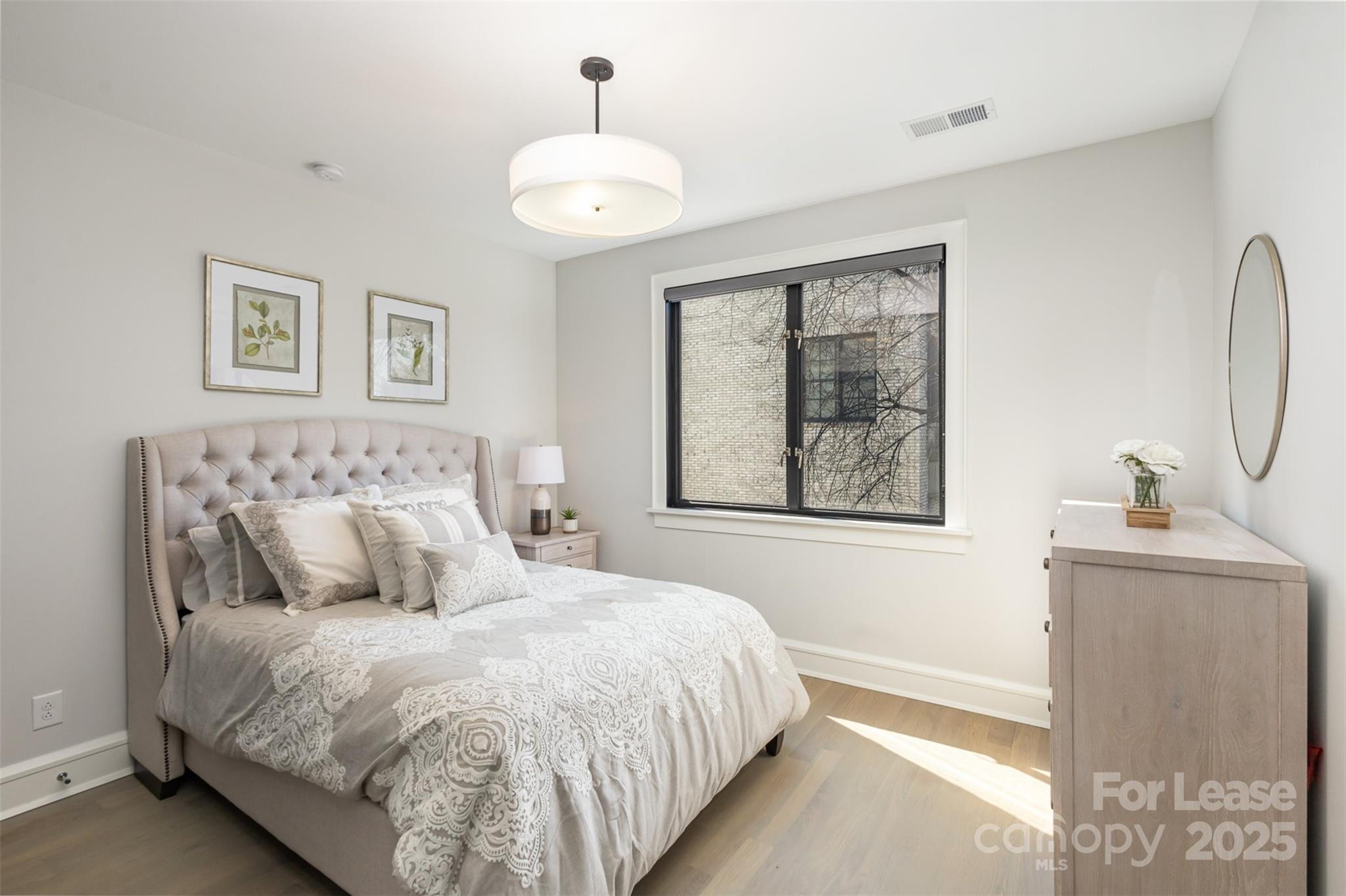 616 Queens Road Charlotte, NC 28204 - Photo 31 of 36 a bedroom with bed and window