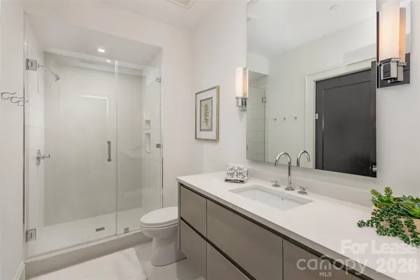 a bedroom with bed and window