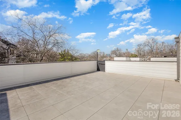 a view of a brick building with many windows