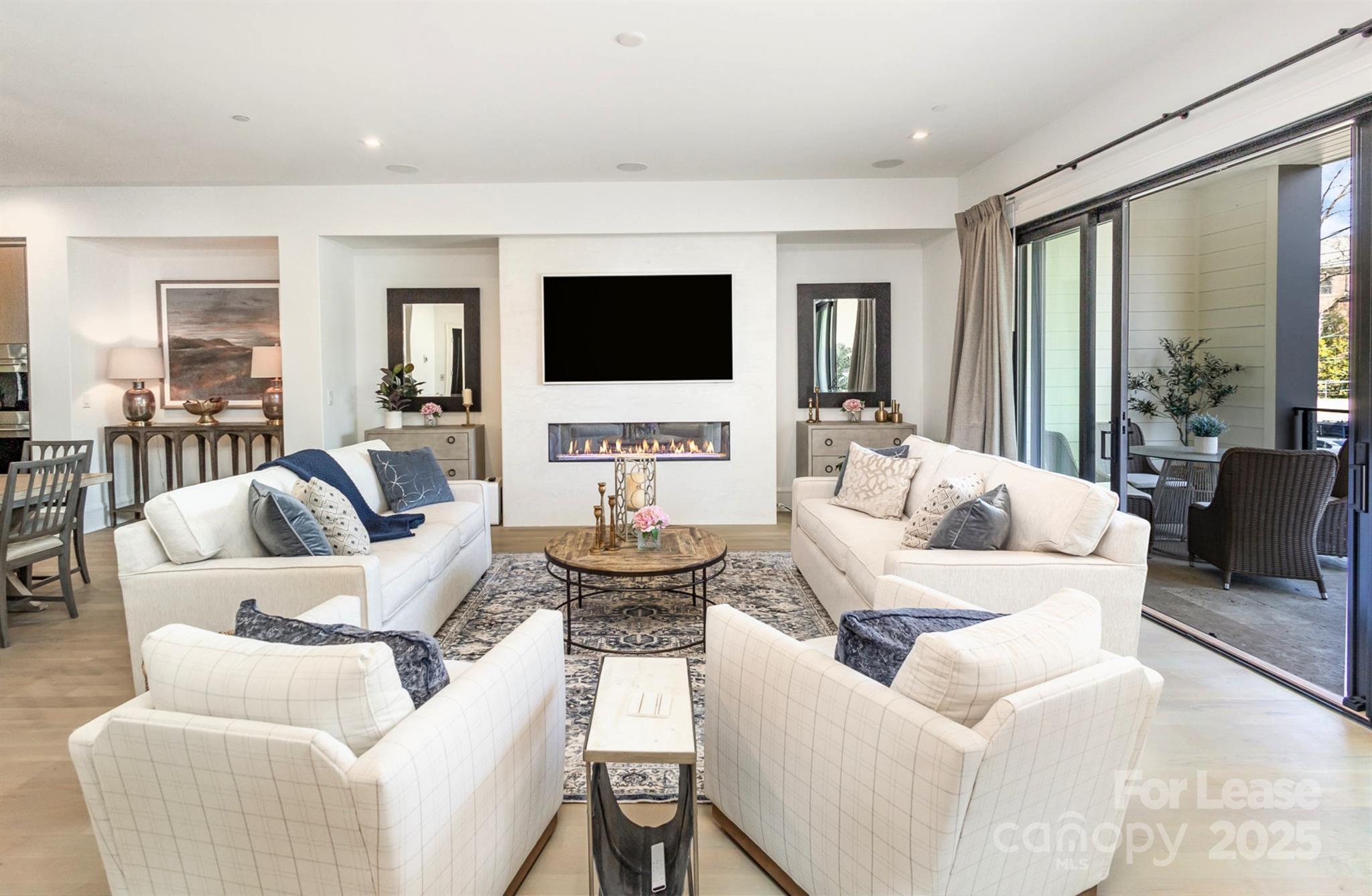 616 Queens Road Charlotte, NC 28204 - Photo 5 of 36 a living room with furniture and a flat screen tv
