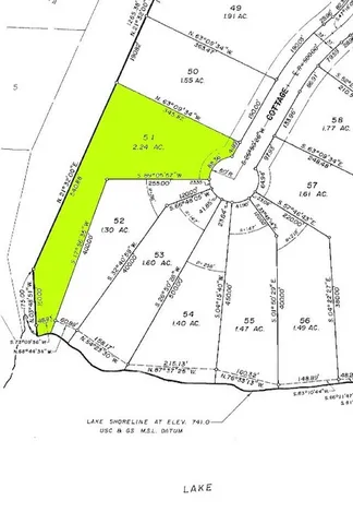 a view of a swimming pool with a yard