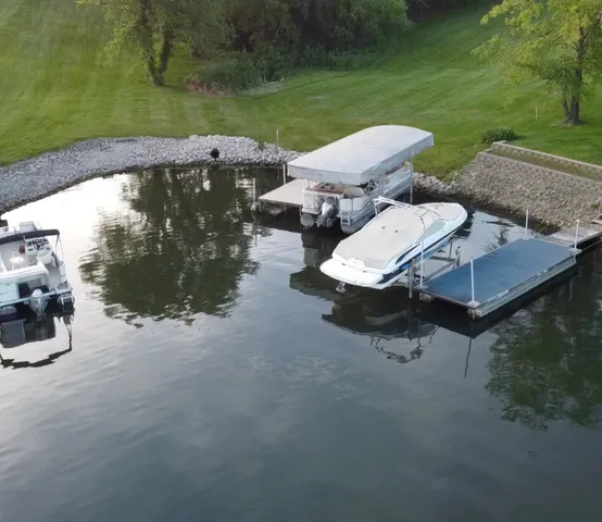 an aerial view of a house with garden space and street view