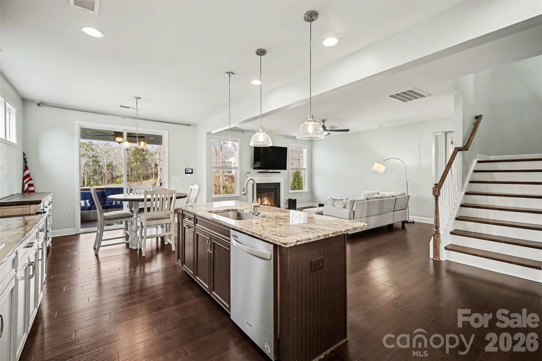 7200 Irongate Drive Lancaster, SC 29720 - Photo 12 of 30 an open kitchen with a table and chairs in it