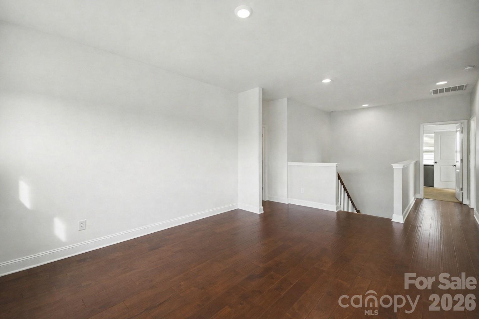 7200 Irongate Drive Lancaster, SC 29720 - Photo 13 of 30 a view of an empty room with wooden floor