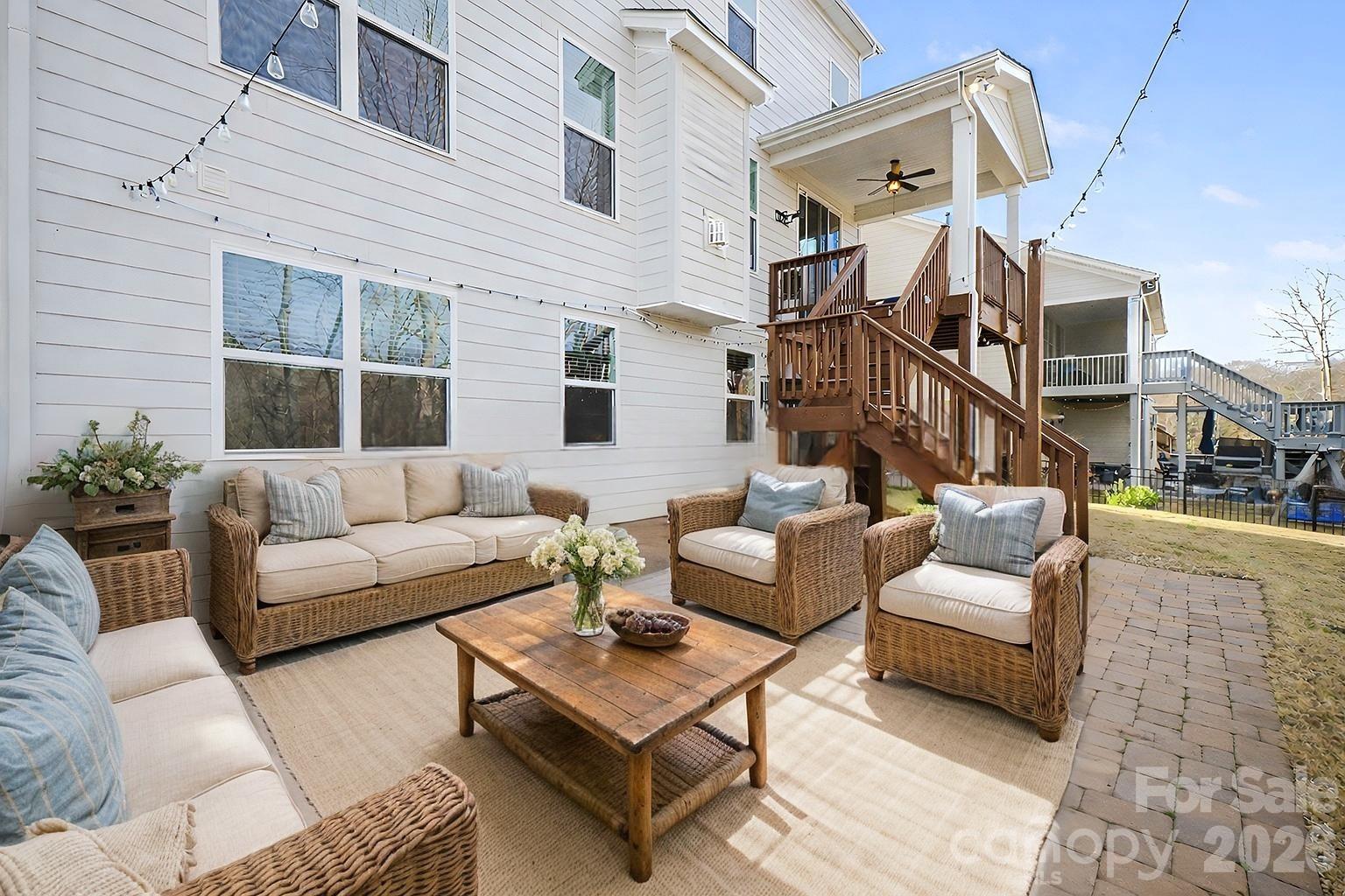 7200 Irongate Drive Lancaster, SC 29720 - Photo 30 of 30 a view of a patio with couches and a dining table and chairs with wooden floor