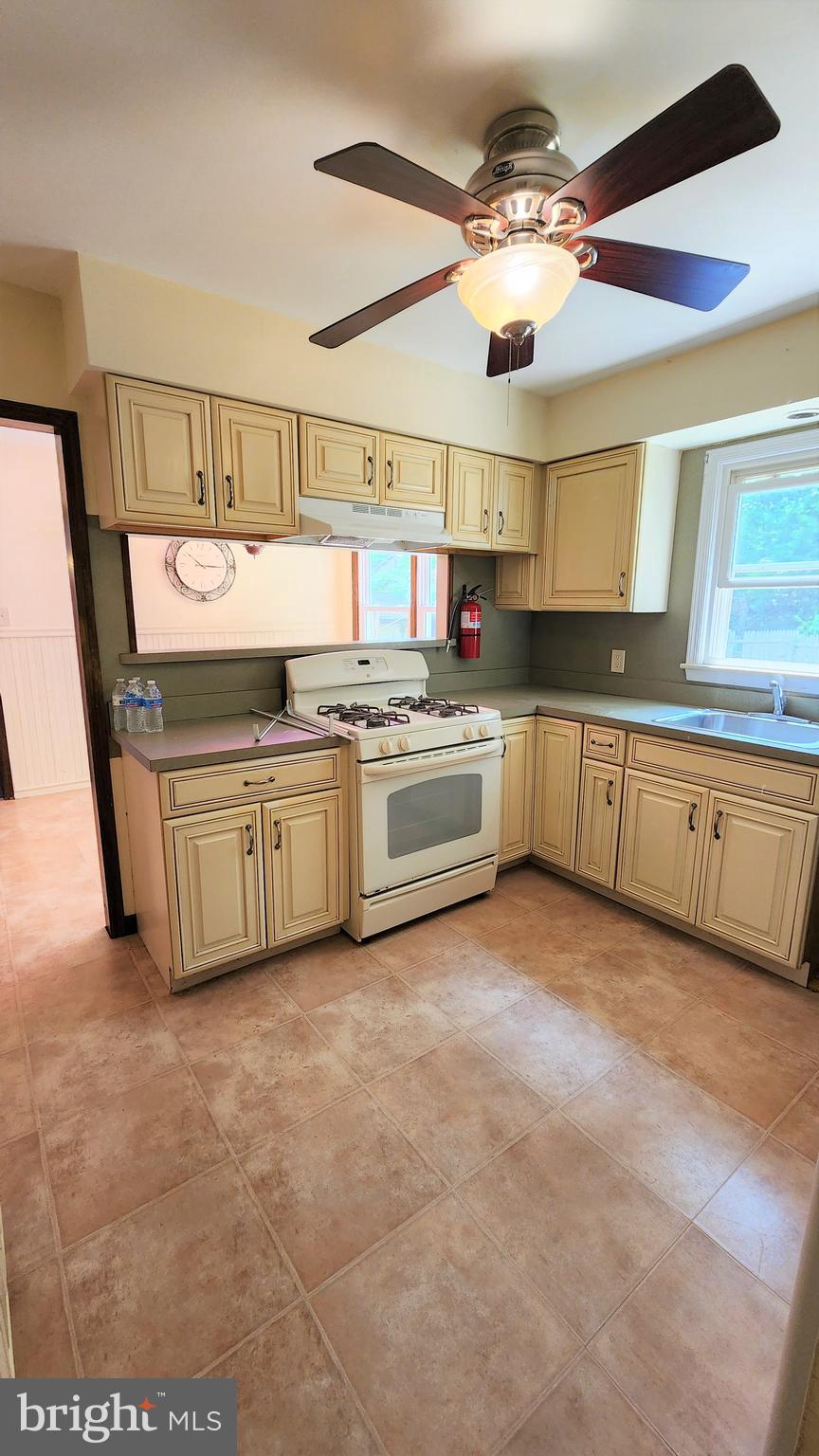 408 Deptford Road Glassboro, NJ 08028 - Photo 3 of 13 a kitchen with stainless steel appliances granite countertop a stove and a sink