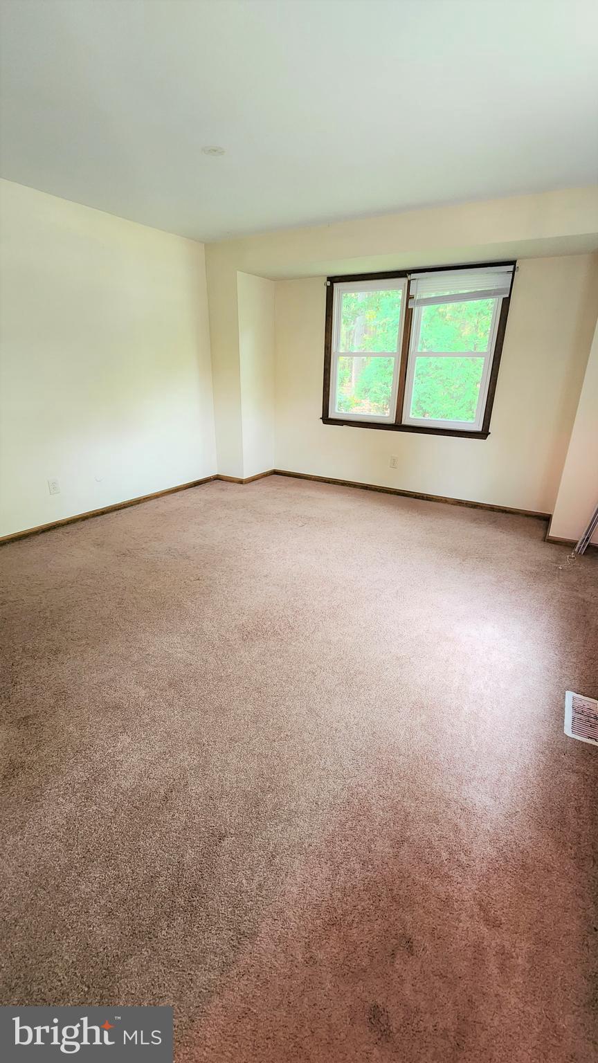 408 Deptford Road Glassboro, NJ 08028 - Photo 6 of 13 an empty room with a window